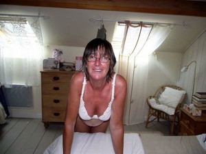This busty mature wife always topless at