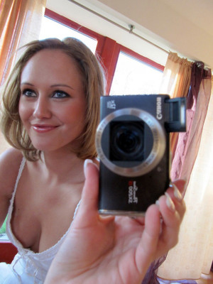 Sexy blonde amateur taking pictures of