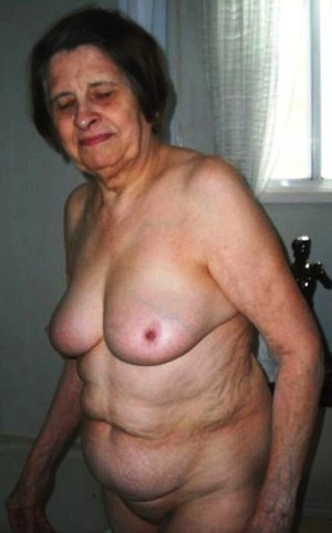 Old woman with wrinkled skin and huge..