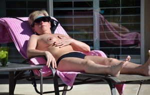 Busty milf nude in the pool